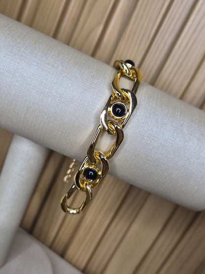 Pulseira Luxo Dourado com Elos Esculturais e Detalhes Ônix